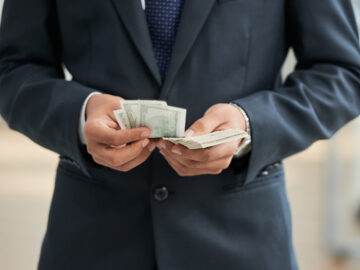 Businessman with dollar currencies